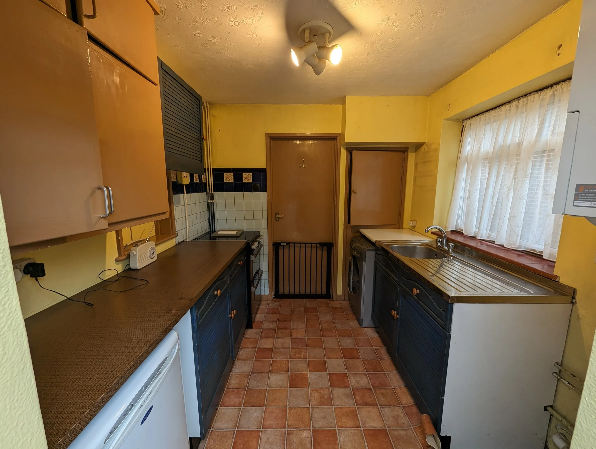 Before the refit: the old sink run and wall-mounted boiler prior to the transformation