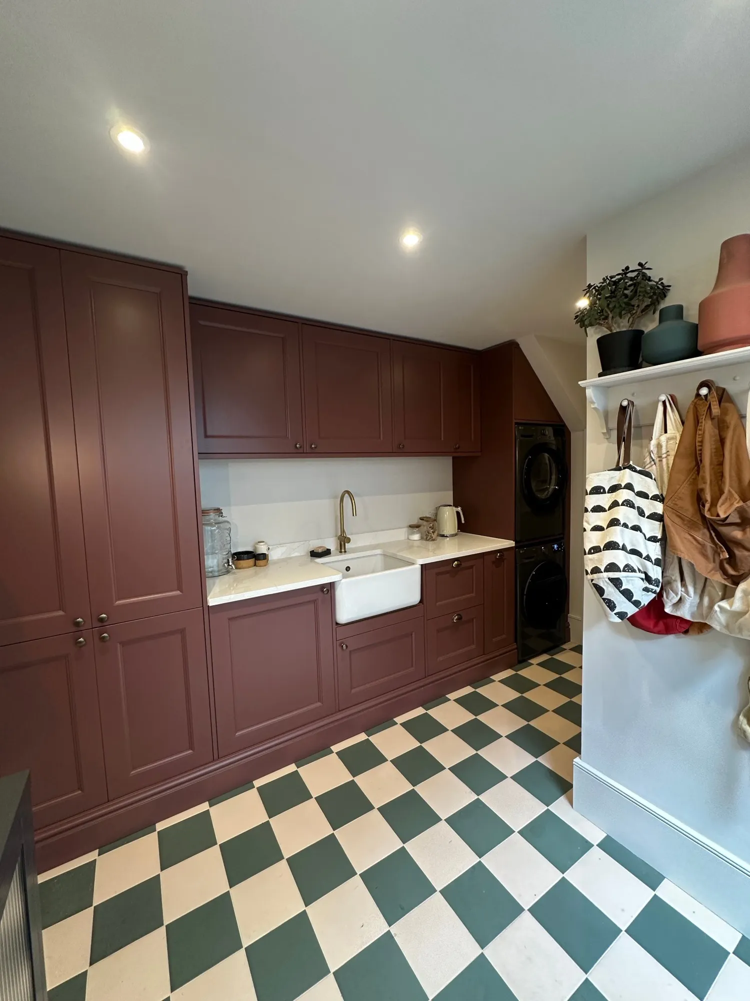 Refitted utility room in deep heather with green and cream checkerboard floor
